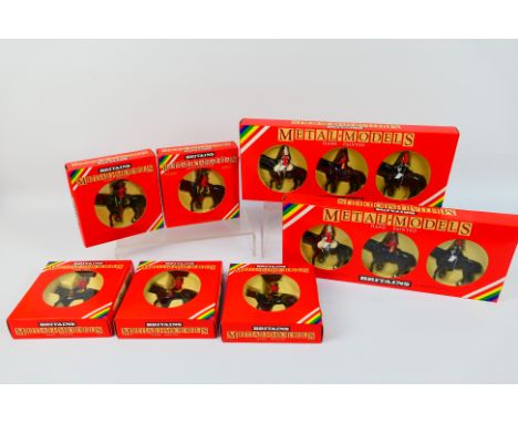 Britains - Seven boxed Britains figures. Lot consists of two Britains #7233 'Her Majesty Queen Elizabeth Mounted Lifeguard & 