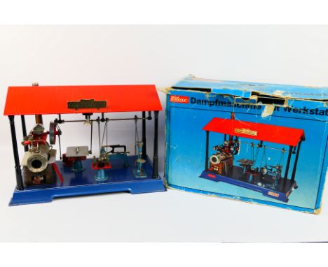 Wilesco - A boxed Wilesco D141 Live Steam Engine with Workshop. The set consists of Steam Engine and flywheel (complete with 