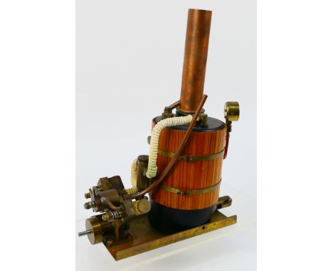 Cheddar - An unboxed 'Puffin' vertical steam. The twin cylinder engine with vertical central flue, and mahogany planked cladd