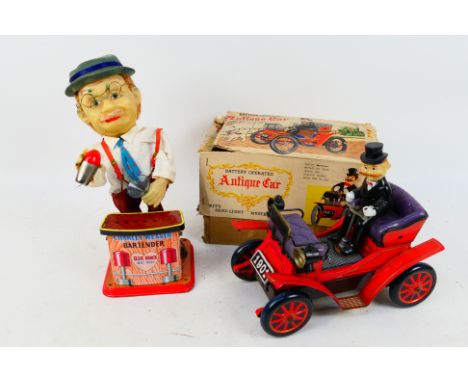 Nomura - Rosko - Two vintage tinplate toys. Lot consists of a boxed Nomura (Japan) tinplate battery operated 'Antique Car'. T