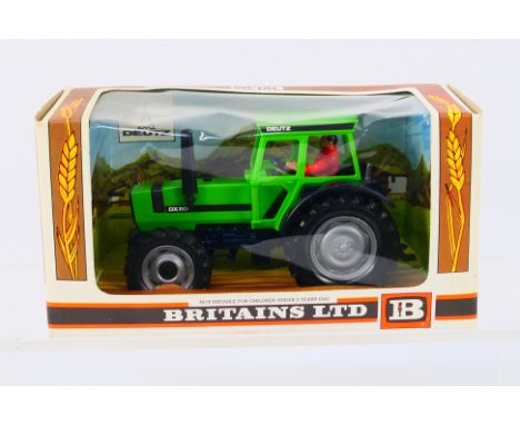Britains - A boxed Britains diecast #9526 Deutz DX110 Tractor. Model appears to be in Mint condition, presented within Excell