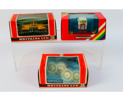 Britains - Three boxed Britains farm implements. Lot consists of #9537 Acrobat Rake; #9553 Disc Harrow; #9548 Crop Spray. The