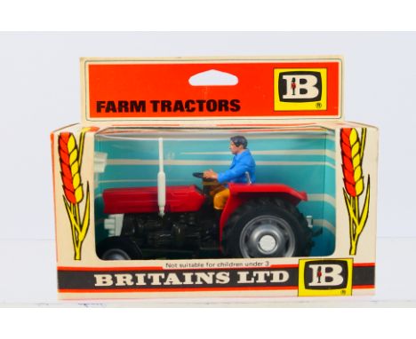 Britains - A boxed Britains diecast #9520 Massey Ferguson Tractor. Model appears to be in Mint condition, presented within Ex