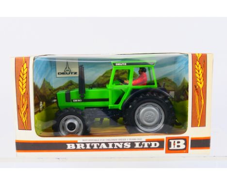 Britains - A boxed Britains diecast #9526 Deutz DX110 Tractor. Model appears to be in Mint condition, presented within Near M