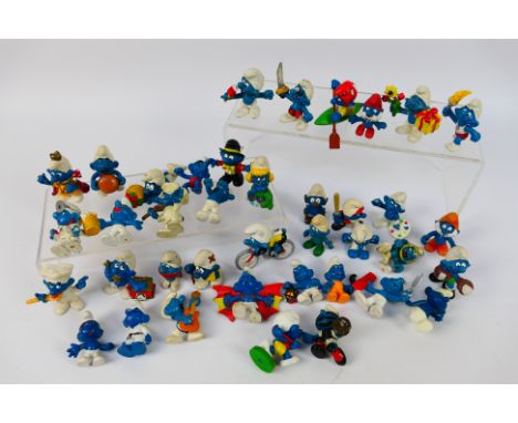 Peyo - Schleich - An unboxed collection of vintage Peyo / Schleich Smurf figures, including Emperor Smurf; Cycle Smurf; Burge