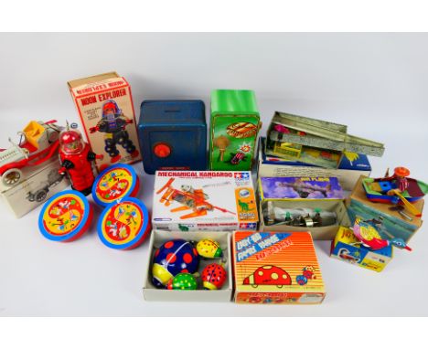 Chinese Made - Other -A mixed group of predominately boxed modern Chinese made tinplate toys, plus other tinplate novelty ite