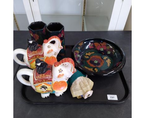 An original Kewpie bisque doll, a pair of painted pottery elephant teapots and three pieces of 'Decoro' pottery