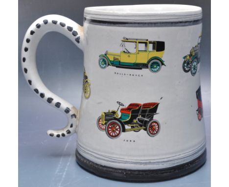 A large retro vintage 20th century Rye Potters " One For The Road " ceramic tankard having polychrome automobile decoration t