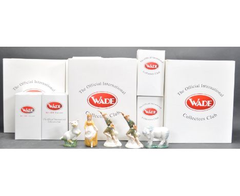 A group of five Wade collectors club ceramic figurines to include Peter Pan, Shetland Pony, Cinderella, and a lamb. All in or