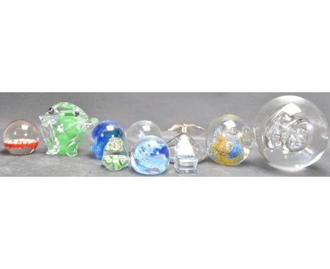 A collection of vintage retro 20th century art studio glass paperweights. The collection includes a lead crystal paperweight 