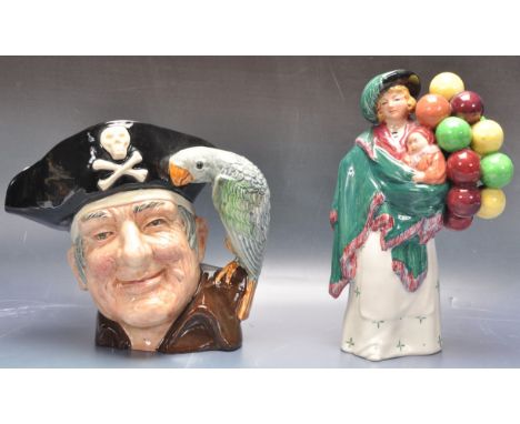 A vintage 20th century Royal Doulton polychrome ceramic figurine The Balloon Seller HN583. Makers stamp to the underside. Tog