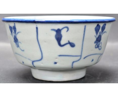 A 18th century Chinese oriental blue and white ceramic bowl / rice bowl. The bowl of a circular form with tapered body raised