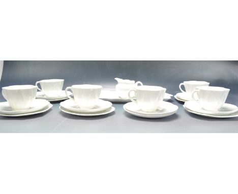 A vintage retro 20th century white ceramic porcelain tea service by Shelley. The tea set comprising of six cups, seven saucer