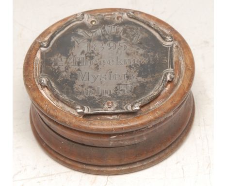 An interesting 19th century turned oak circular snuff box, the push-fitting cover with silver coloured metal plaque inscribed