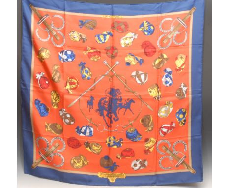 An Hermes silk scarf, Hong Kong Jockey Club, designed by Ledoux, printed with jockey caps and stirrups, 88cm 