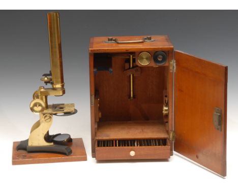 A 19th century brass monocular microscope, marked W Baldwin, Shipley, 36cm high, fitted mahogany cabinet 