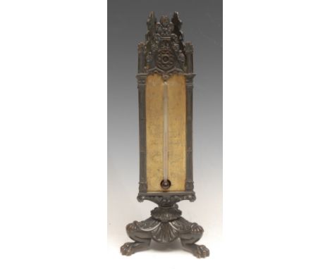 A 19th century French dark patinated bronze library writing table companion, the Gothic Revival triform superstructure with t