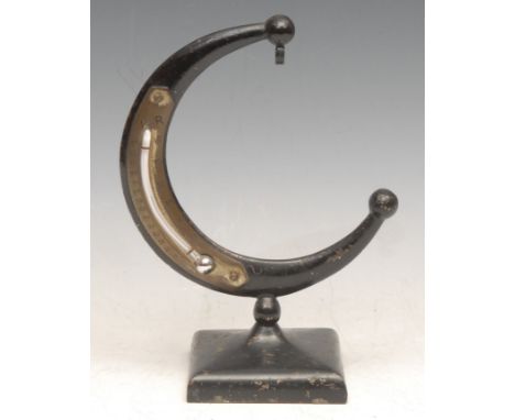 An early 20th century cast iron crescent shaped combination pocket watch stand and desk thermometer, 17cm high 