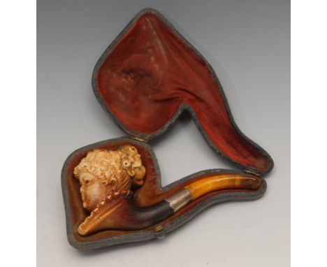 A 19th century German novelty meerschaum pipe, carved as the head of a lady, 11.5cm long, c.1890, cased 