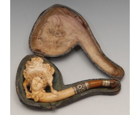 A 19th century German novelty meerschaum pipe, carved as the head of a lady, dressed a la mode, 10.5cm long, c.1890, cased 