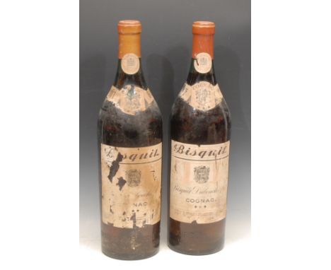 A pair of large French dummy wine bottles, Bisquit Doubouche Cognac, 49cm high 