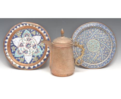 A Kashmiri copper ewer or coffee pot, profusely chased in the Persian taste with stylised lotus and scrolling foliage, hinged
