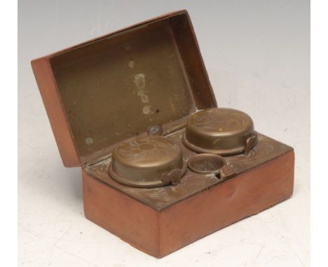 An early 20th century leather-clad travelling inkwell, hinked cover enclosing twin compartments, 9.5cm wide, c.1910 