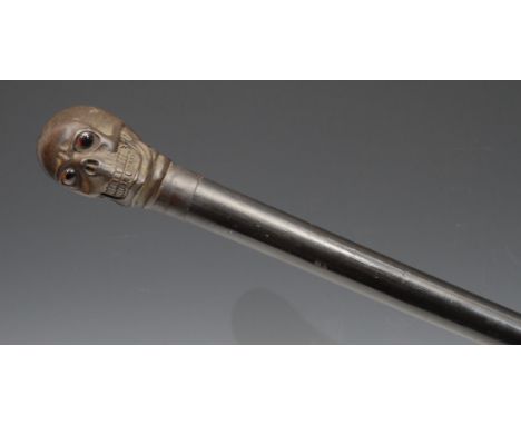 The Macabre - a bronze mounted novelty walking stick, the pommel as a skull, glass eyes, ebonised cane, 87.5cm long 