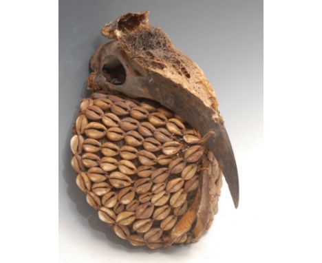 Tribal Art - an African hat or mask, decorated with cowrie shells and crested by a hornbill skull, 15cm wide, possibly Lega, 