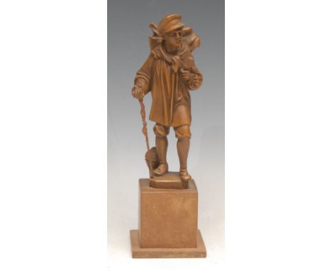 A German figure, of a huntsman, he stands, smoking a meerschaum pipe, his game basket on his back, square plinth, 19cm high, 