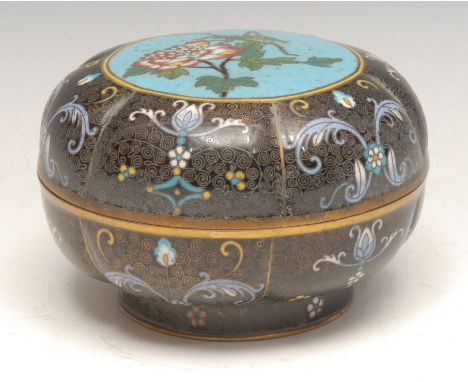 A Chinese cloisonne enamel lobed circular box and cover, decorated with a grasshoper, flowers, foliage and scrolls, 11cm diam