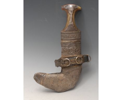 A Middle Eastern silver coloured metal mounted jambiya dagger, 17.5cm curved blade with central ridge, horn hilt, 29cm long o