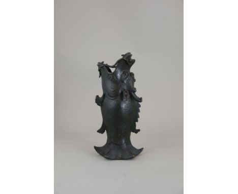 A Bronze Dragonfish Vase, Ming dynasty, standing on his hexagonal fishtail, with fishlike body and fierce dragon head with ja