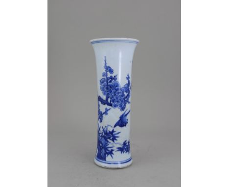 A Blue and White 'Magpie and Prunus' Vase, early Kangxi, of plain beaker form, decorated in bright cobalt with a continuous s