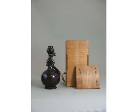 A Bronze Dragon Vase, 17th century, of bottle form with garlic neck,  finely modelled with an archaistic qilong,in high and o
