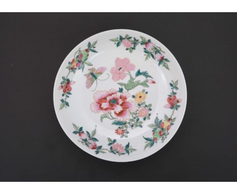 A Famille Rose Peony Dish, 19th century, of rounded shape, two bunches of peony and butterfly painted in famille rose on the 