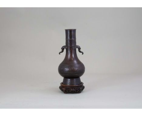 A Bronze Bottle with Elephant Head Handles, Song/Yuan dynasty, with bands of leiwen around the tall flared foot and on the cy