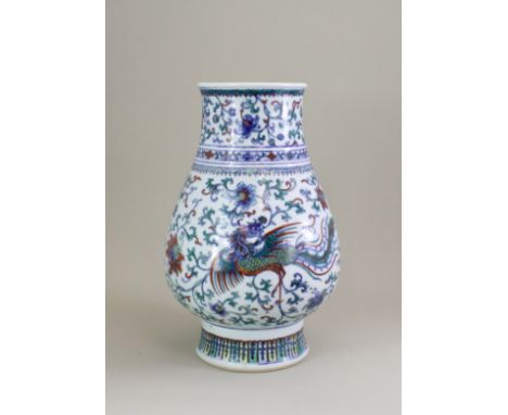 A Doucai 'Phoenix' Vase, Hu, 18th century, of pear shape, well decorated in a combination of enamel and dark underglaze blue 