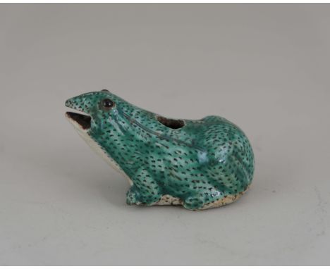 A 'famille verte' Biscuit Frog Waterdropper, Kangxi, well carved and moulded in a seated posture, black dotted over his upper