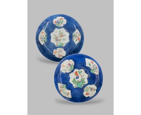 A Pair of Blue ground 'Famille Vert' Floral Dishes, Kangxi, of circular shape, each decorated against a 'bleu souffle' ground