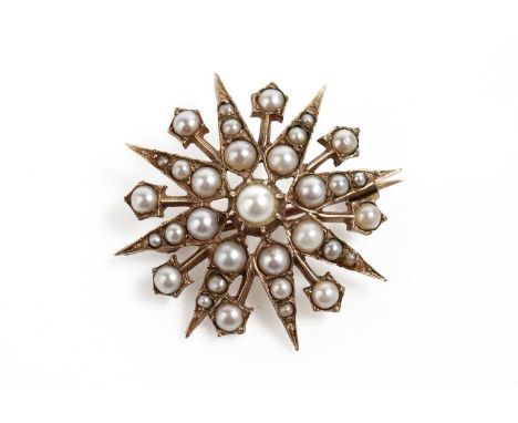 An Edwardian seed pearl star brooch pendant, in yellow gold, unmarked, surface tests as approximately 9ct, 30mm diameter, 5.3