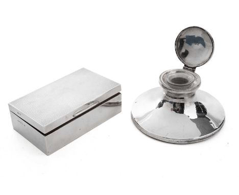 A silver capstan form silver inkwell, with engraved initial ‘A’, hallmarks worn, filled base, 14cms diameter; together with a