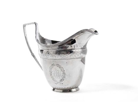 A Georgian Newcastle silver cream jug, marks worn, of helmet form, with engraved monogram, 4.1oz gross.