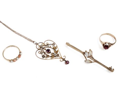 An opal bar brooch, in 9ct yellow gold, 55mm wide; a garnet single stone ring, in yellow gold, stamped "10K", size K; and a s