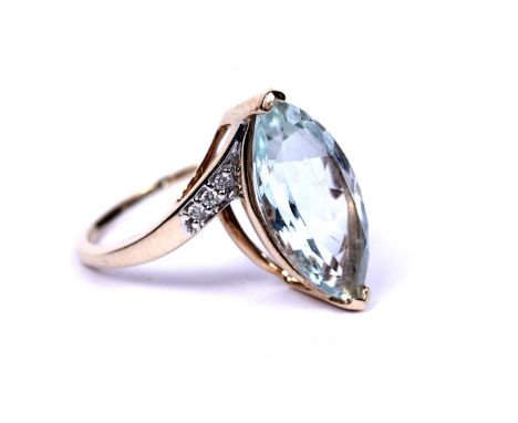 A Santa Maria aquamarine and diamond dress ring, the marquise cut aquamarine weighing approximately 3.25 carats, on round cut