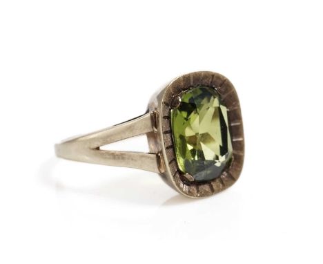 A grossular garnet single stone dress ring, in yellow gold, stamped "585", size N 1/2, 5.2g gross.