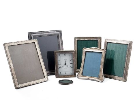 A collection of silver photo frames, the largest measuring 20 x 25cms high; and a silver framed Harrods of Knightsbridge desk