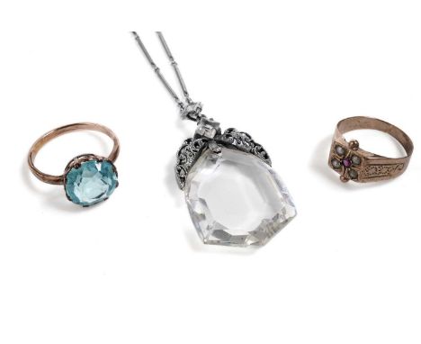 A Victorian seed pearl and ruby ring, in rose gold, unmarked, shank resized, size H, 1.4g gross; a blue paste cocktail ring, 
