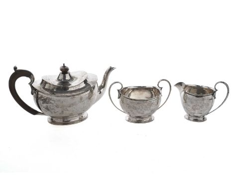 A George V silver three-piece tea service, by Alexander Clark &amp; Co Ltd, Birmingham 1915, comprising teapot, cream jug and