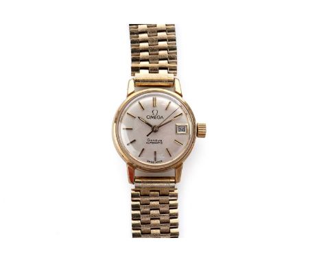 An Omega Genève gold plated automatic wristwatch, the silvered circular dial with baton hour markers and date aperture at 3, 
